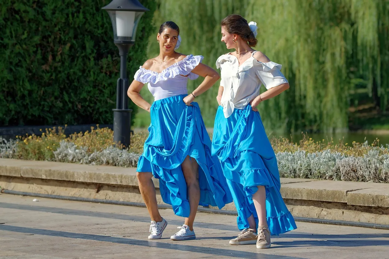 Salsa dancers in colorful outfits