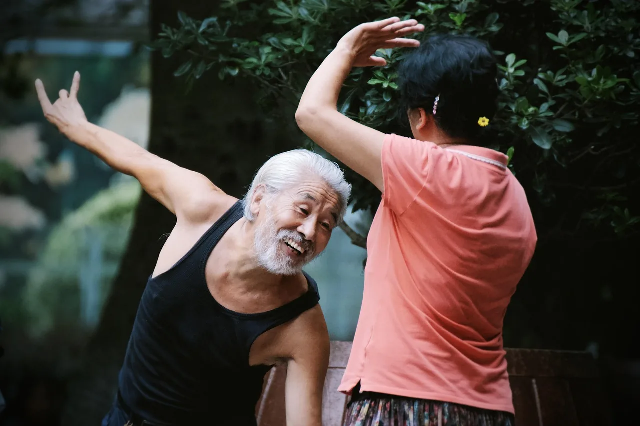 Senior couple dancing enthusiastically Senior couple dancing enthusiastically