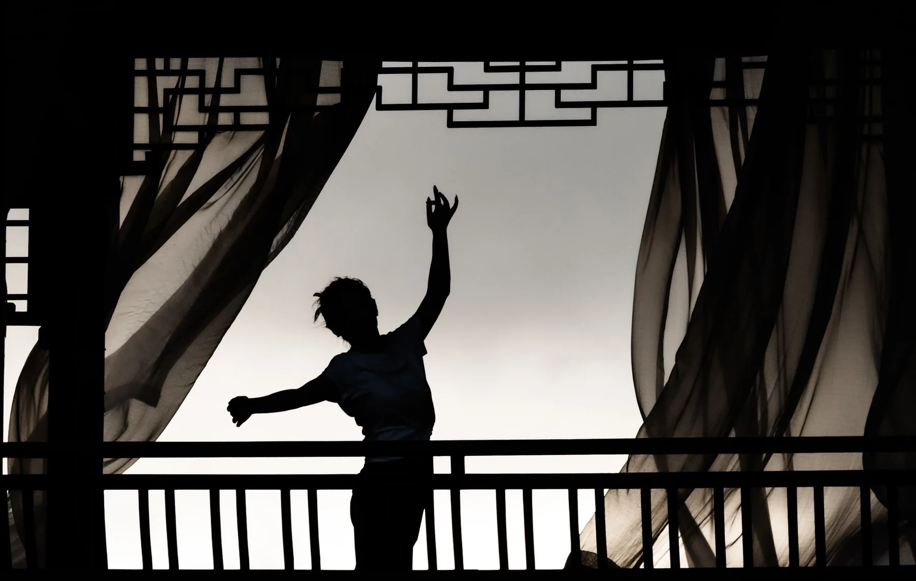Dancer moving behind curtains